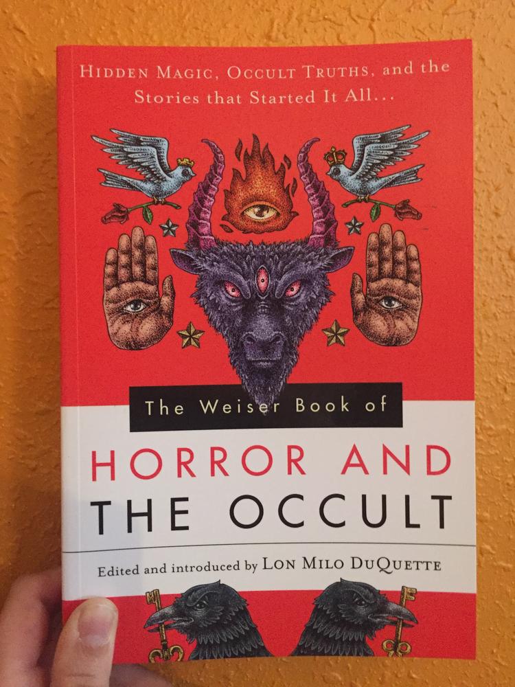 Red cover with occult and magical imagery 