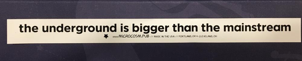 a white vinyl sticker with the text "the underground is bigger than the mainstream"