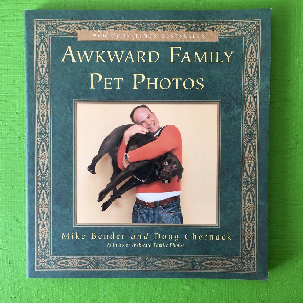 book cover with a photo of a grinning person hugging a nonplused dog