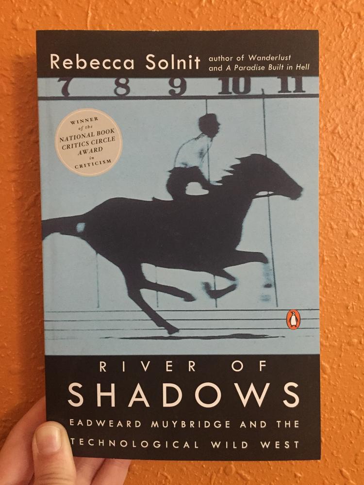 Blue cover with the profile of a jockey riding a horse