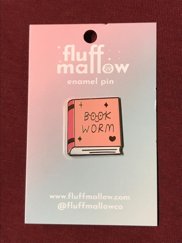 a book in pink with the words 'book worm' on the cover