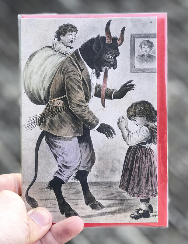 A devilish goat-like figure with a child in a bag strapped to his back towers over a small girl deep in prayer.