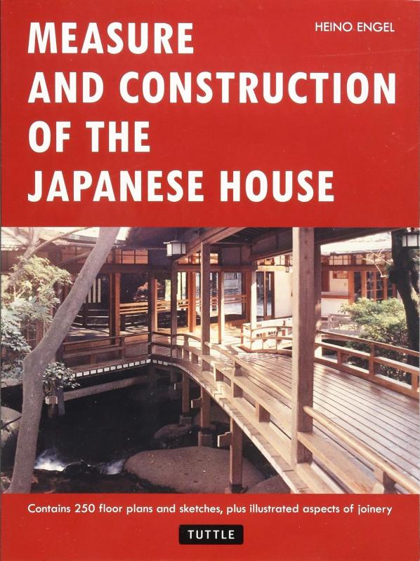 A photo of a Japanese home with an airy porch and walkway over a stream