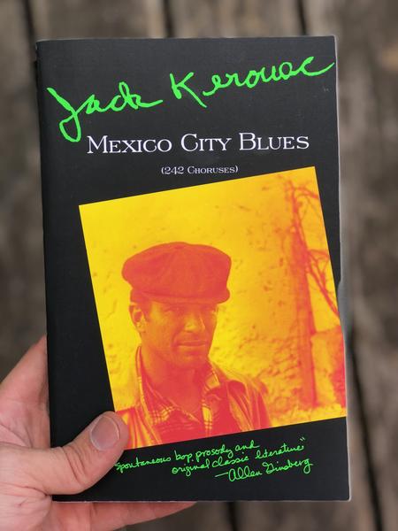 an eschew sepia-tone photograph of Jack Kerouac