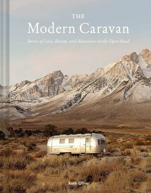 Airstream camper next to some hills/small mountains
