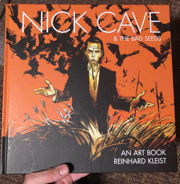 An illustration of Nice Cave standing in a field, crows flying around him.