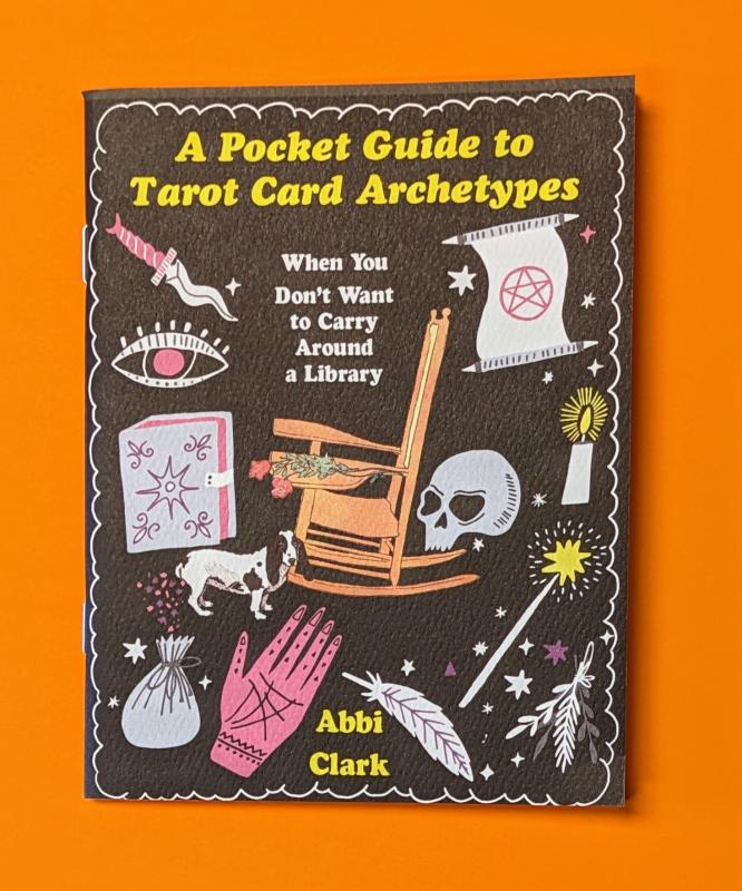 a skull, a hand, a feather, a crooked knife, an eye, a rocking chair, a candle, a scroll with a pentagram, and other assorted tarot-related items