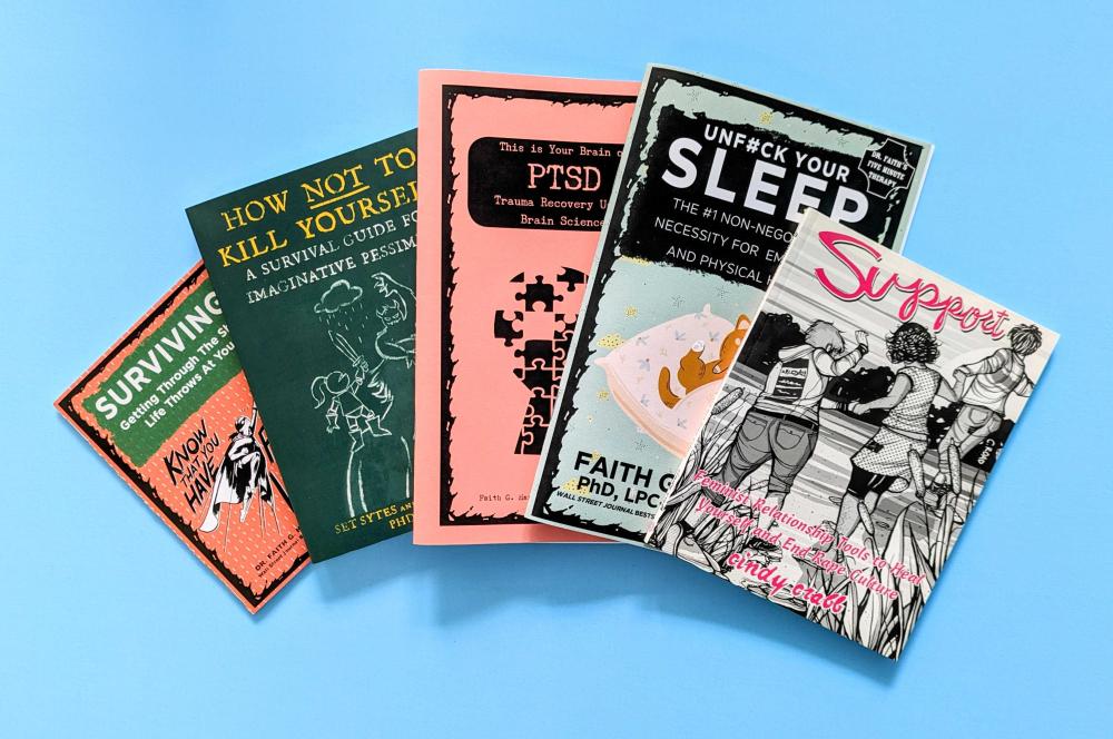 an array of life-saving books and zines