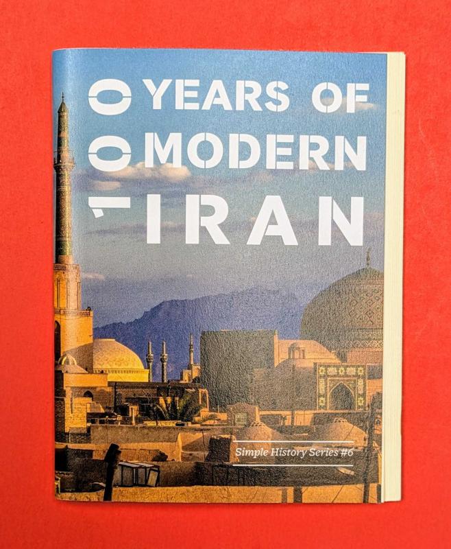 zine cover with a photo of hundreds gathered around a city center in Iran