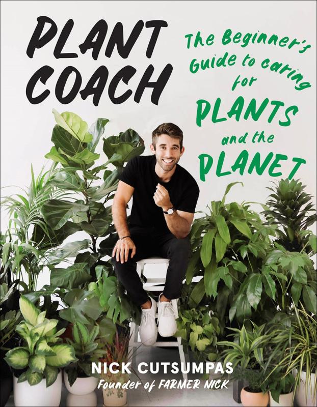 A photo of the author surrounded by tropical plants