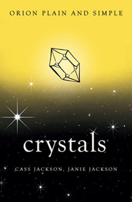 a geometric outline of a crystal over a yellow background that fades to black with twinkles