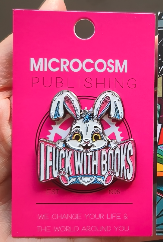 a cartoonish rabbit holding text that reads i fuck with books