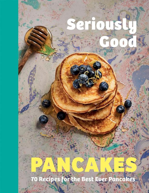 top-down view of a stack of pancakes with a honey dipper 