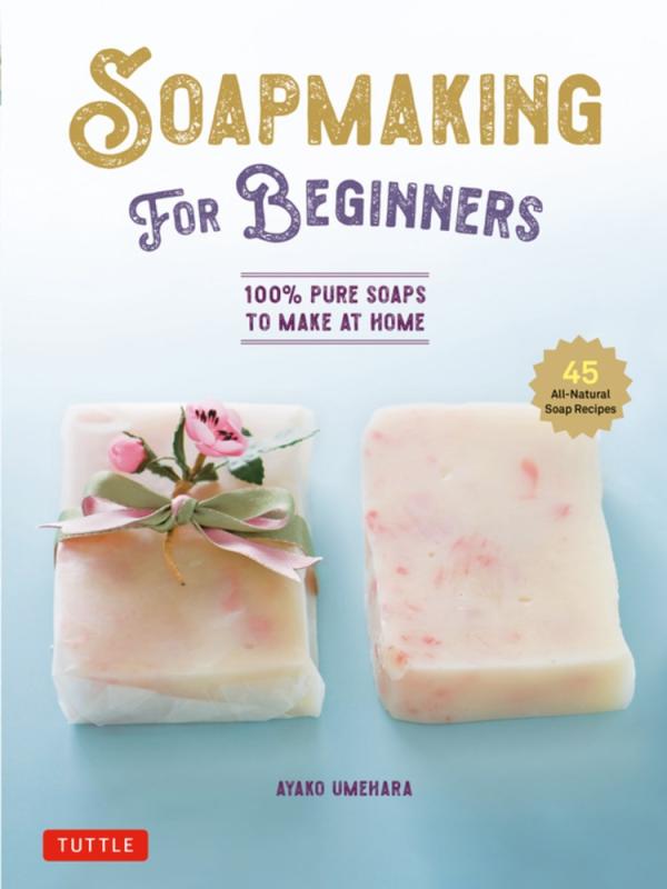 two bars of homemade soap over a gradient light blue background 