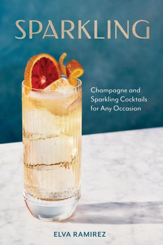 light yellow libation in a glass with a citrus wedge and ice