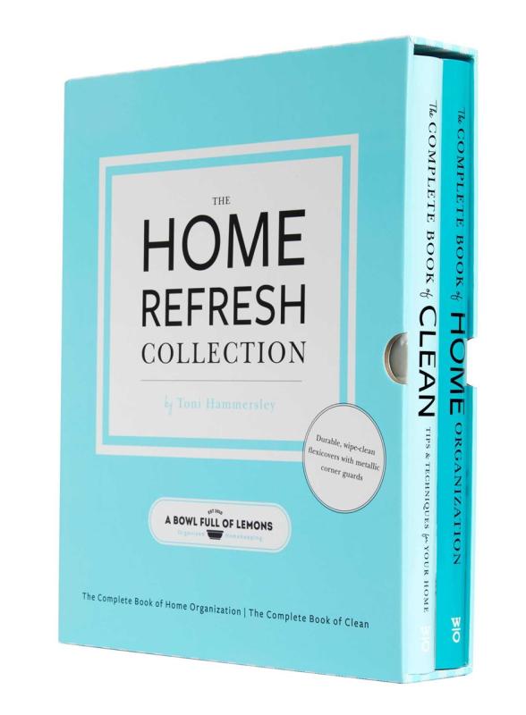 Two books in a blue slipcase over a white background