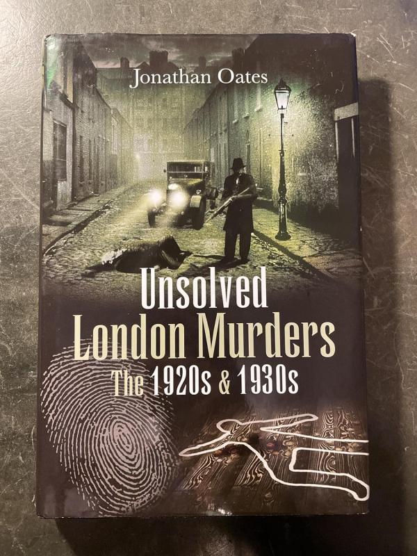 murder in the street above a fingerprint and a body outline