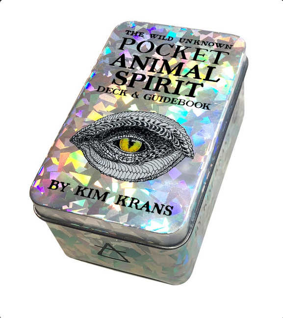 A shiny and glittery metal deck box with black text and an image of a scaled eye.