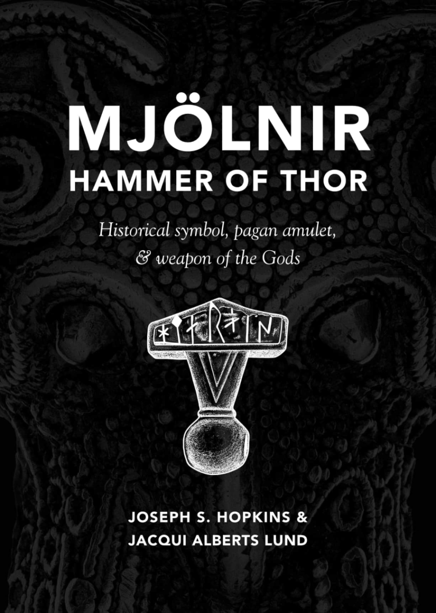 Symbol of a hammer with runes etched upon it, over an ornate arcane background