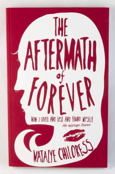 A red book cover with a white silhouette of a face with long hair and a lipstick stain