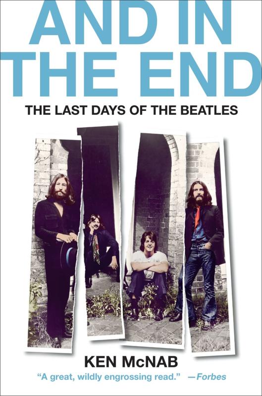 white cover with a photo of the beatles torn between each member