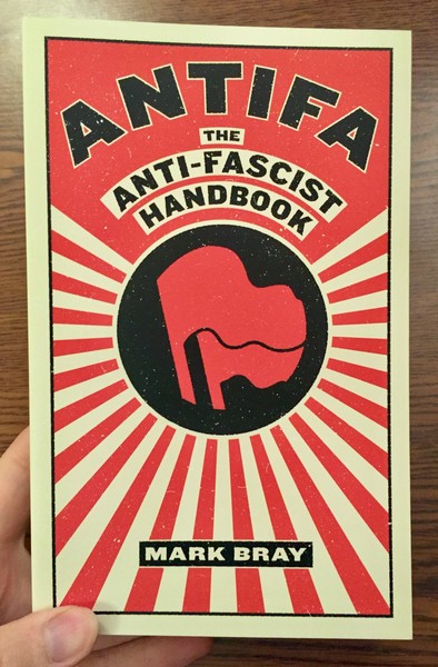 Antifa: The Anti-Fascist Handbook by Mark Bray [Red Flags in a black circle]