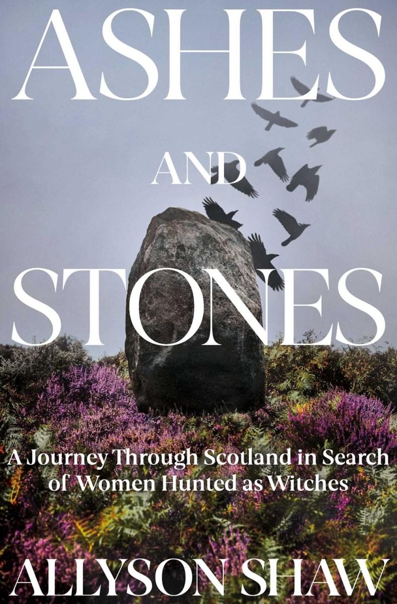 crows in a cloudy sky over a stone in lush florid ground