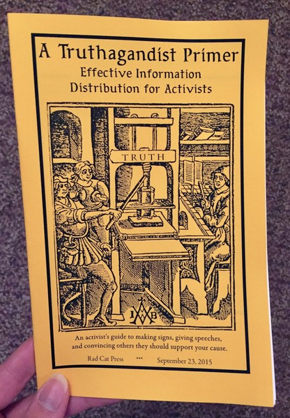 Cover of A Truthagandist Primer which features a black and white illustration of three people running a printing press which has the word TRUTH on it.