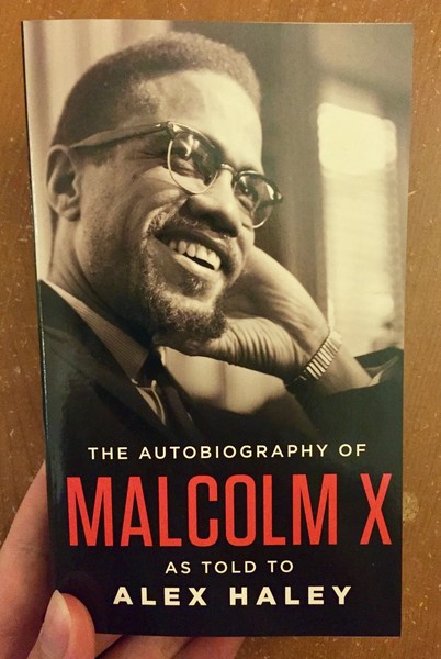 Autobiography of Malcolm X, The by Malcolm X and Alex Haley [A black and white portrait of Malcolm X]