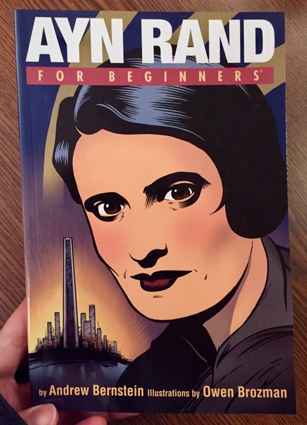 A book cover depicting Ayn Rand's face with a city outlined in the bathroom.