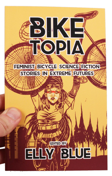 Biketopia cover featuring a costumed woman holding a bicycle above her head