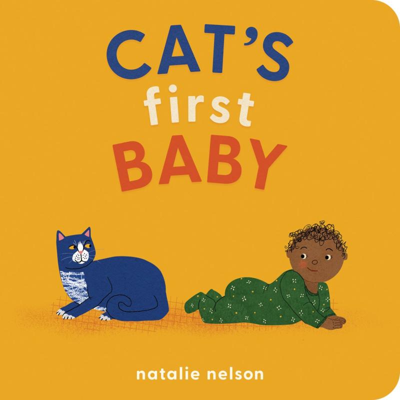 cat and crawling baby looking at each other