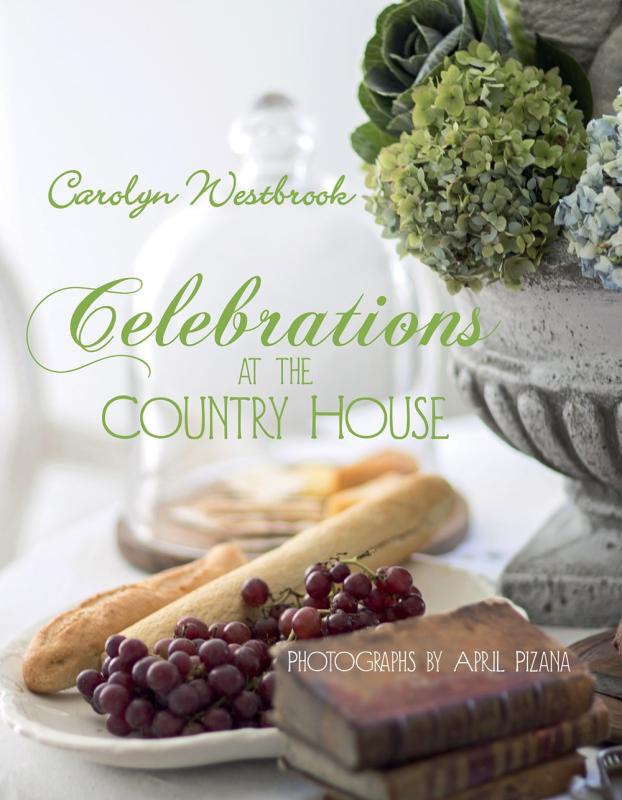white curtains and table cloth with plates full of food with green text