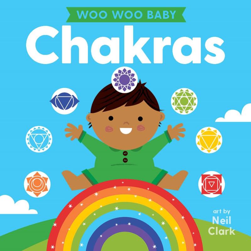 Baby sits on a glittering rainbow, surrounded by motifs representing different chakras