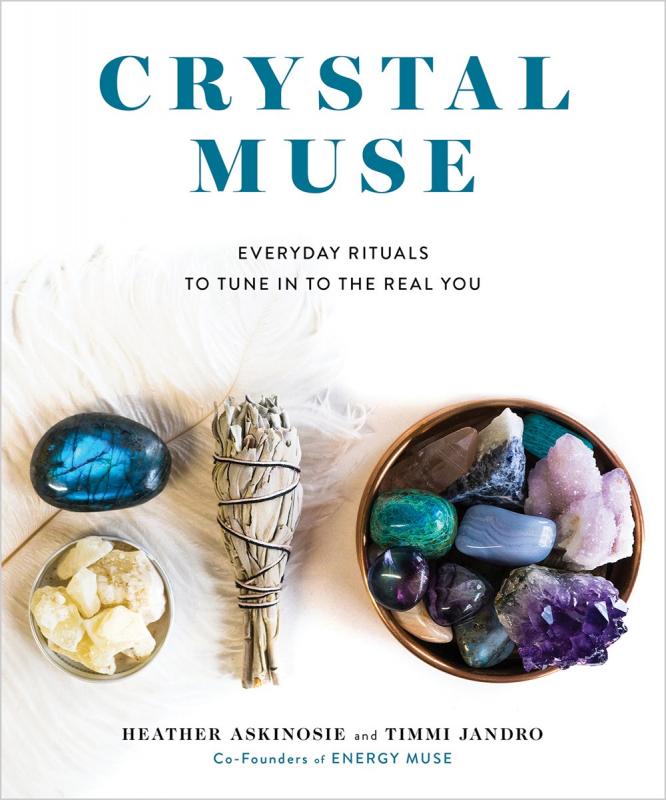 two bowls of crystals, a bundle of sage, and a blue crystal