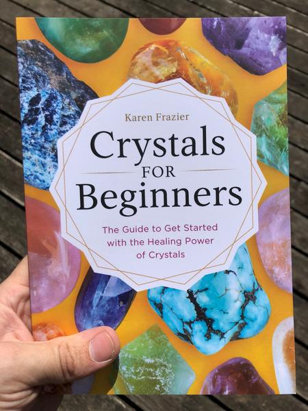 yellow background with colored crystals and a white crystal shape in the middle with words: Crystals for Beginners: The Guide to get started with the healing power of crystals