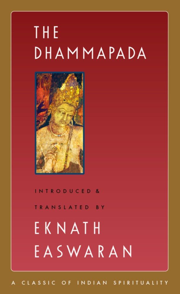 red cover with gold border with white text and a gold Buddha