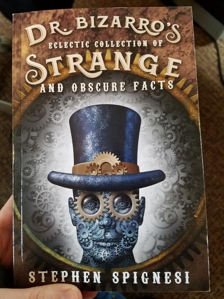 Cover of Dr. Bizarro's Eclectic Collection of Strange and Obscure Facts has a human-like head made of gears with a top hat on it.