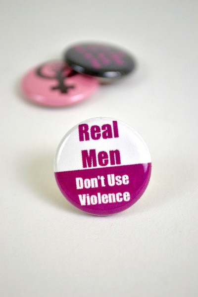 Button with the text Real Men Don't Use Violence