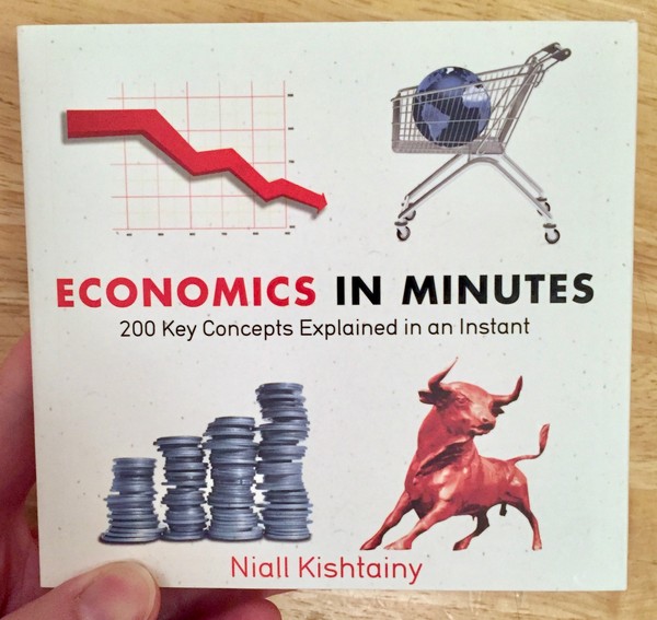 white book cover with four pictures of coins, a bull, a globe in a shopping cart, and a graph