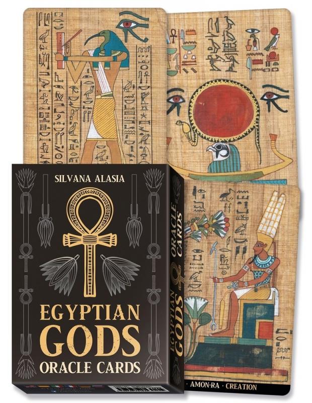 three cards and a deck box, with an ankh on the deck box and various egyptian hieroglyphs and gods on the cards