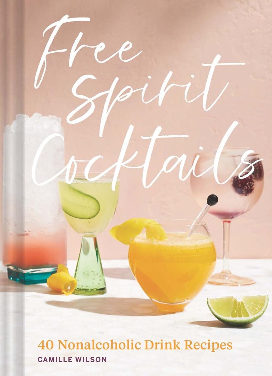 pink cover with white text and glass of orange liquid