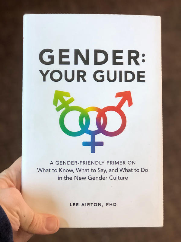 3 rainbow-colored gender symbols linked together.