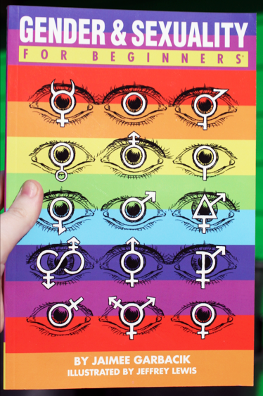 Rainbow striped book cover depicting eyes showing various signs in their pupils