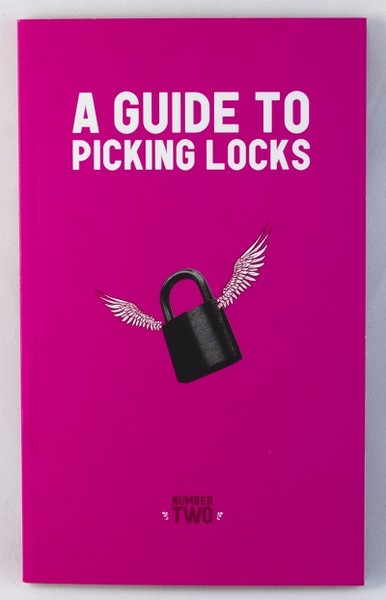 a pink book with an image of a locker-type lock with wings