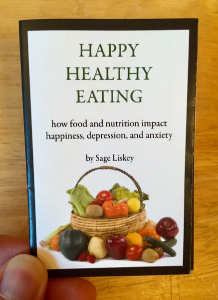 Happy Healthy Eating by Sage Liskey [A basket of veggies sits on some veggies]