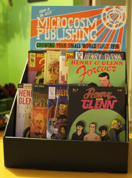 a display box featuring a set of Henry & Glenn books and zines