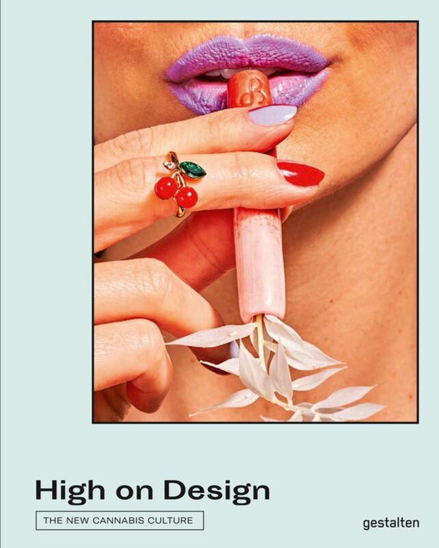 closeup of a person holding a pink and red marijuana pipe against purple-lipsticked lips.