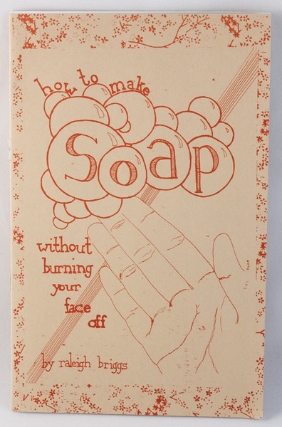 Zine cover with a drawing of a hand and soap bubbles