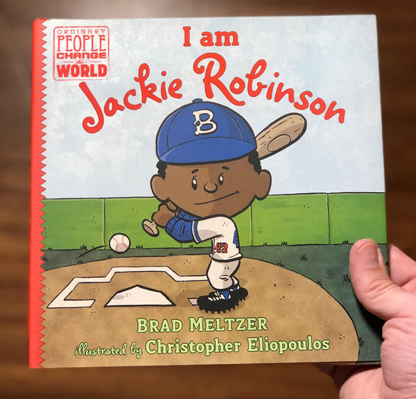 cute cartoon jackie robinson about to smack a home run